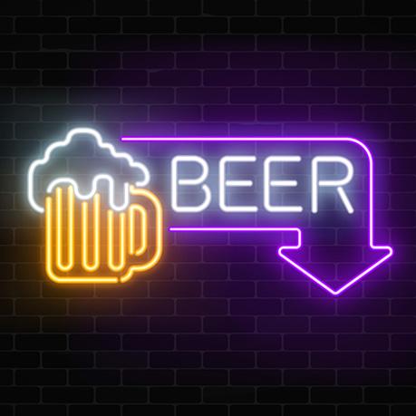 A neon sign showing an outline of a beer in a mug with the word 'beer' highlighted