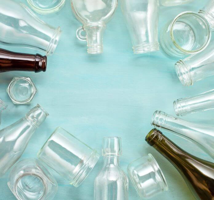 Circle of clear and amber glass packaging.