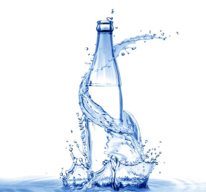 Glass bottle with water splash.