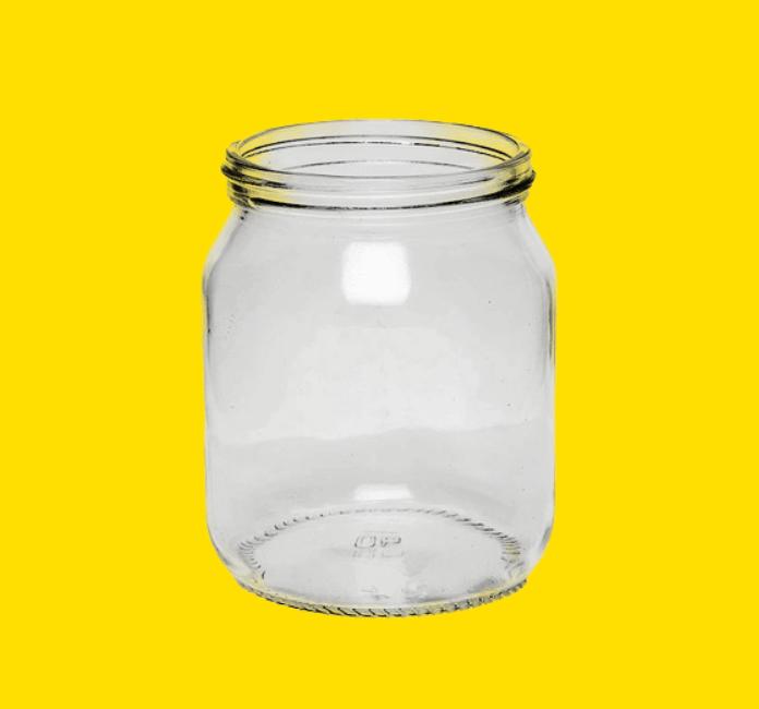 1lb Glass honey jar on a yellow background