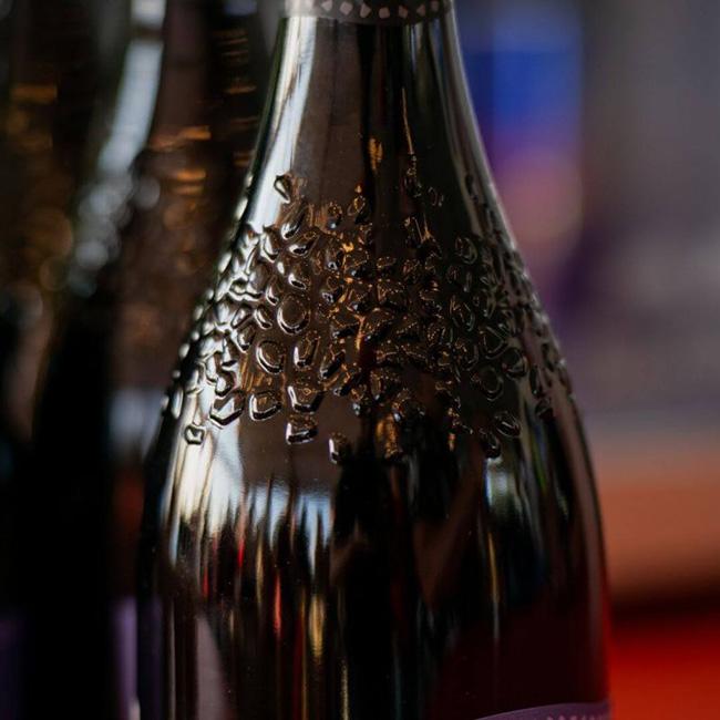 An embossed amber wine bottle