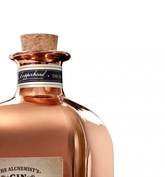A spirits bottle with gold metallic coating. 